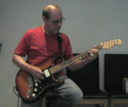 John playing Guitar